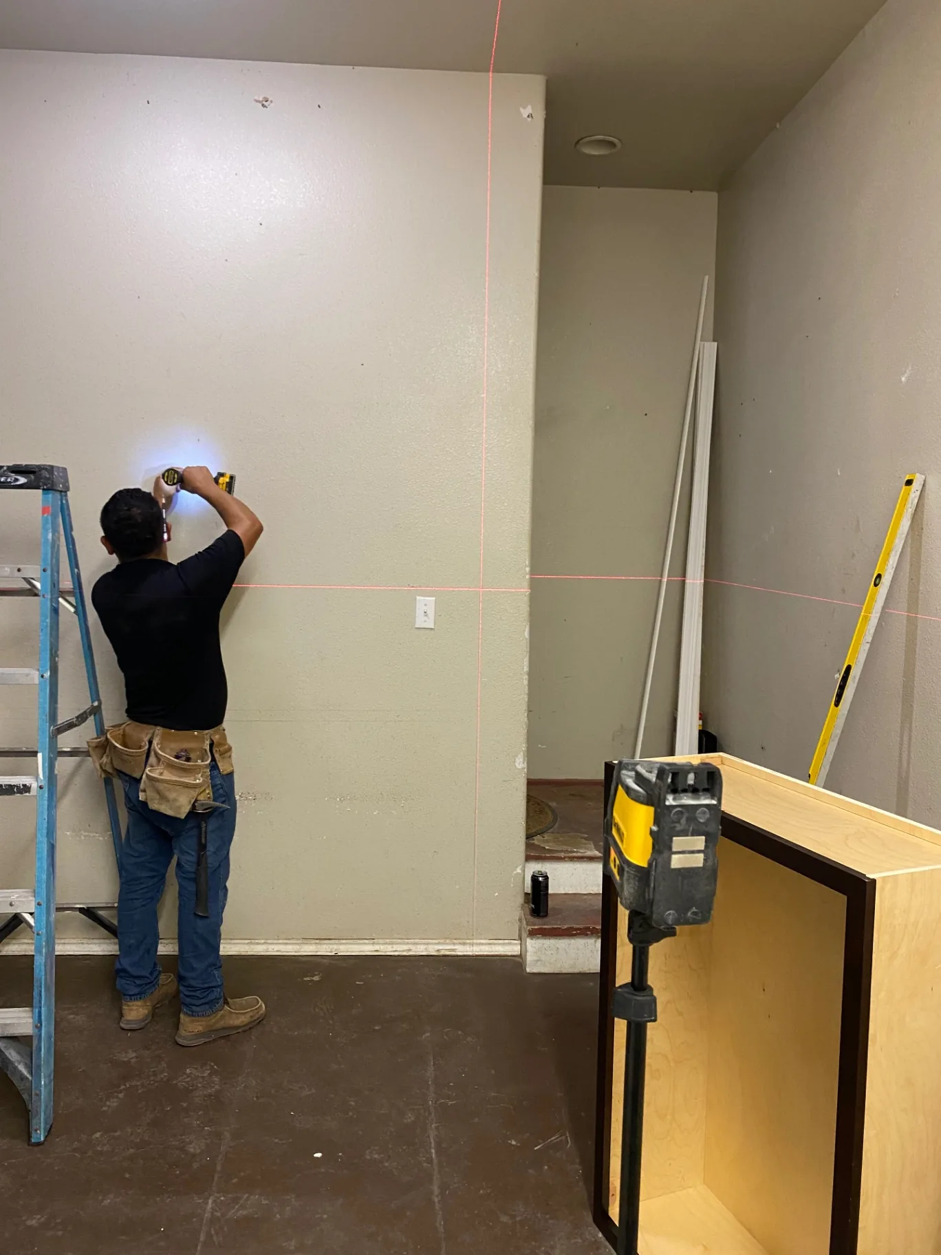 Laser level layout on the installation wall