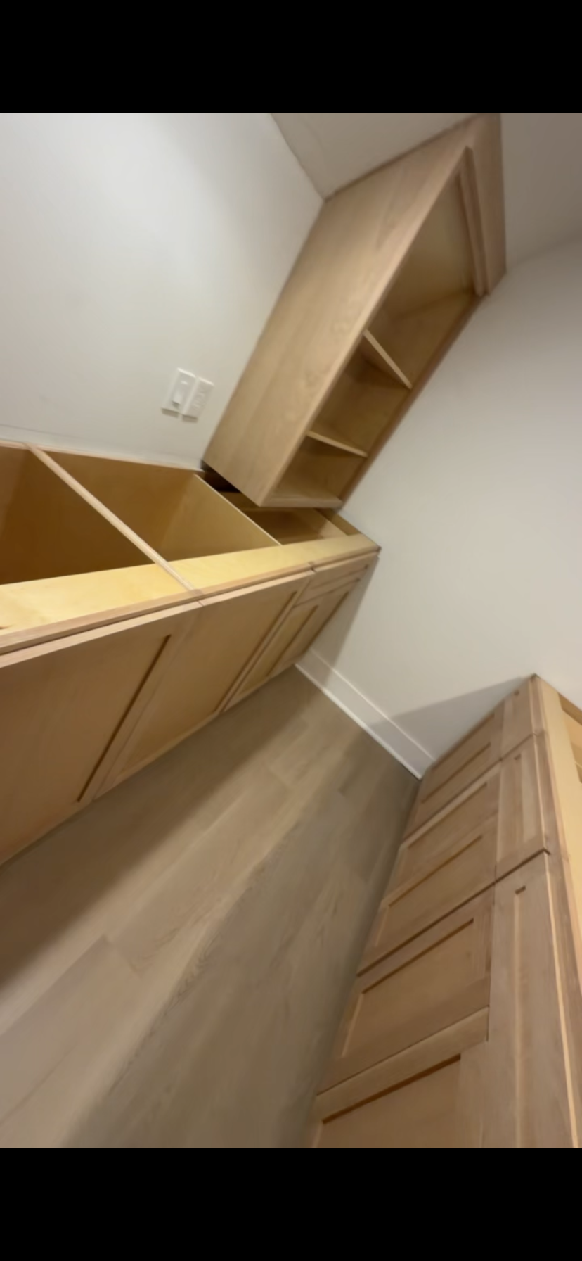 Natural maple shaker kitchen installation with open shelving by Rodriguez Cabinets in Houston