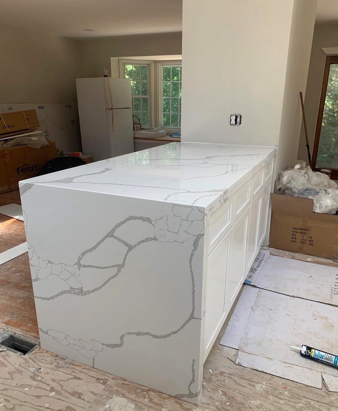Waterfall Quartz Island by Rodriguez Cabinets in Houston