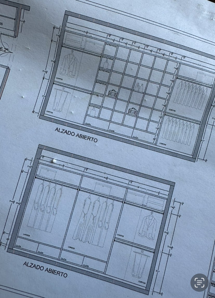 Open elevation shop drawings of two closet systems with hanging rods and shelf cubbies